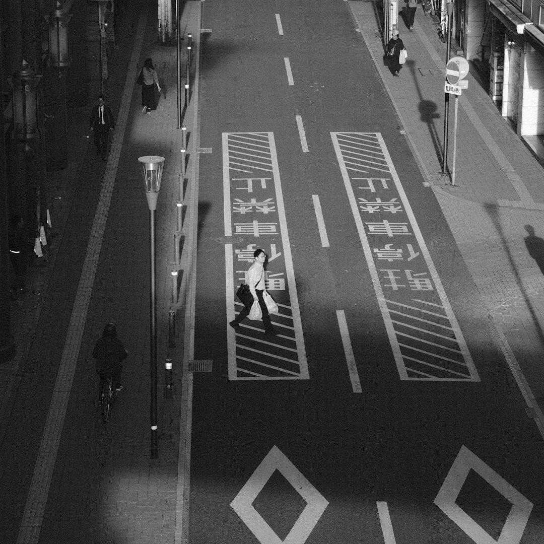 Danish woman cycling through a city street