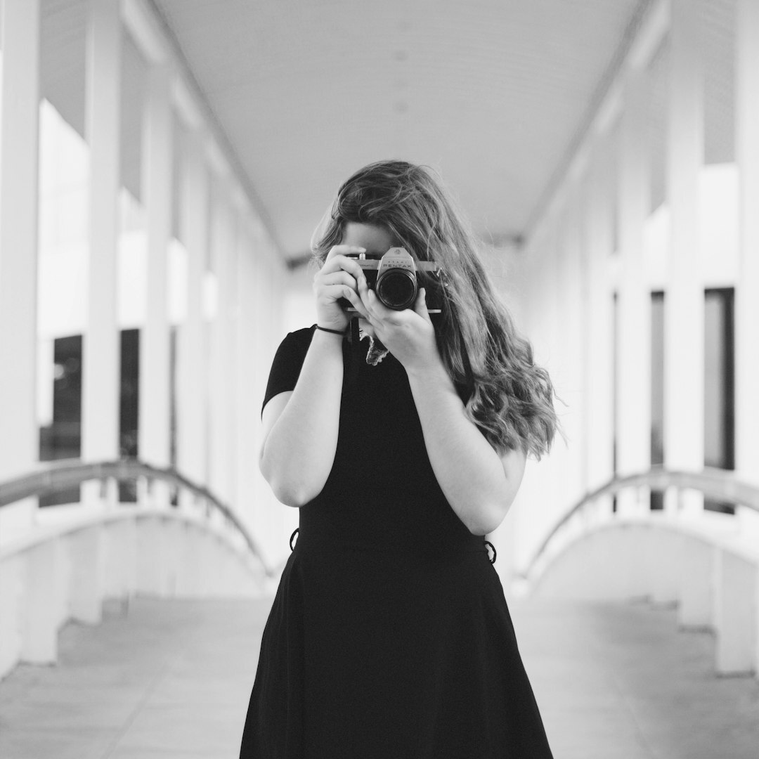 Portrait of a Danish male photographer holding a camera