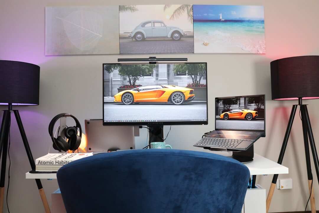 Photographer's editing desk with dual monitors and prints