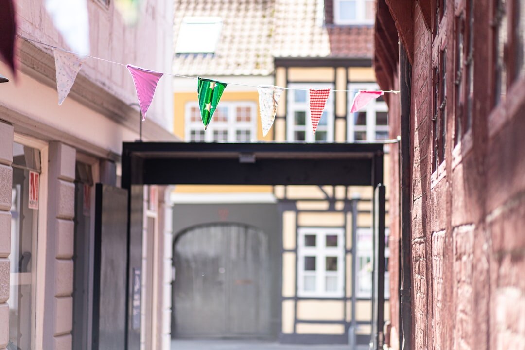 Old cobbled alley in Odense with hanging lanterns