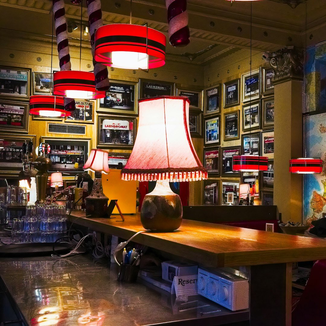 Photographer setting up lighting inside a restaurant